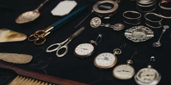 A selection of vintage pocket watches and antiques on display, embodying retro elegance