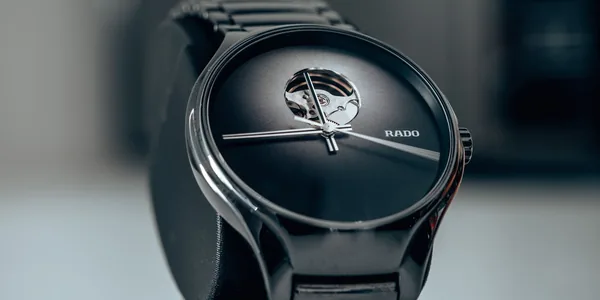 Close-up shot of an elegant black wristwatch showcasing modern luxury design