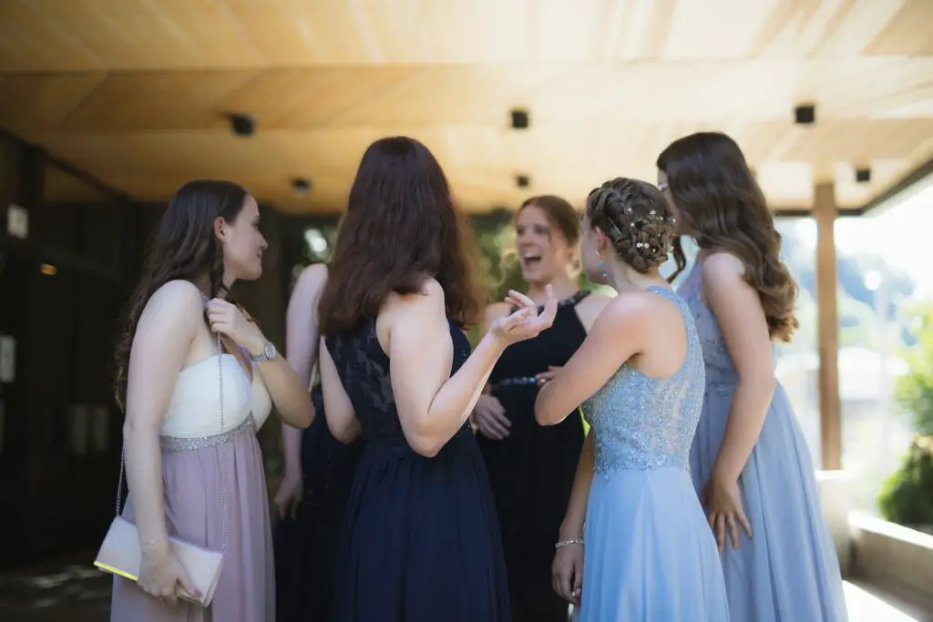 dress codes, woman in black dress standing in front of woman in white dress