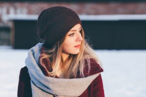 a woman wearing gray scarf